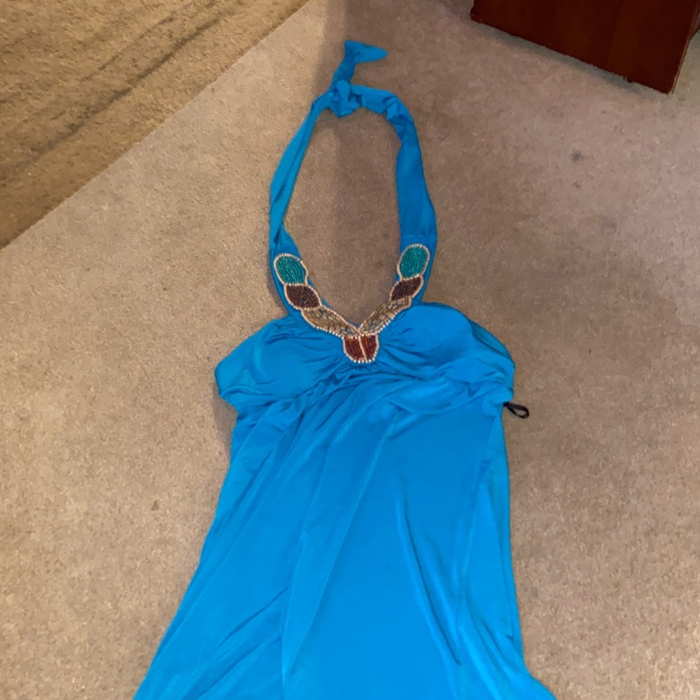 A fun and cute dress! It’s blue with a pretty neck piece.